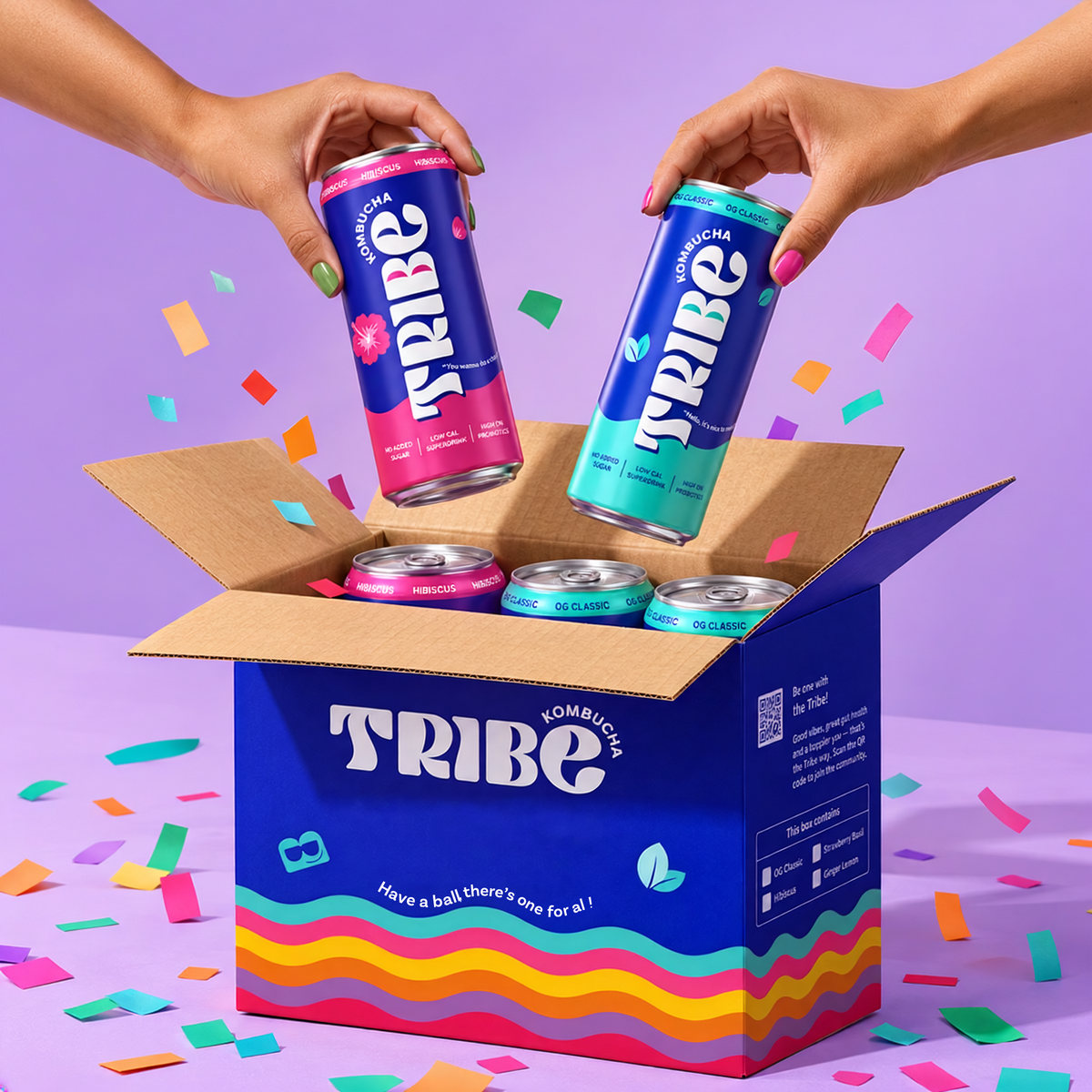 Two hands holding cans of Tribe Energy drink above an open blue cardboard box filled with more cans, set against a purple background with colorful confetti scattered around.